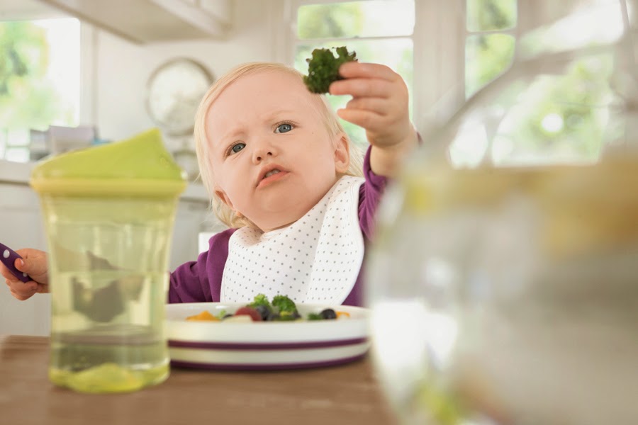 Girl_holds_broccoli_small